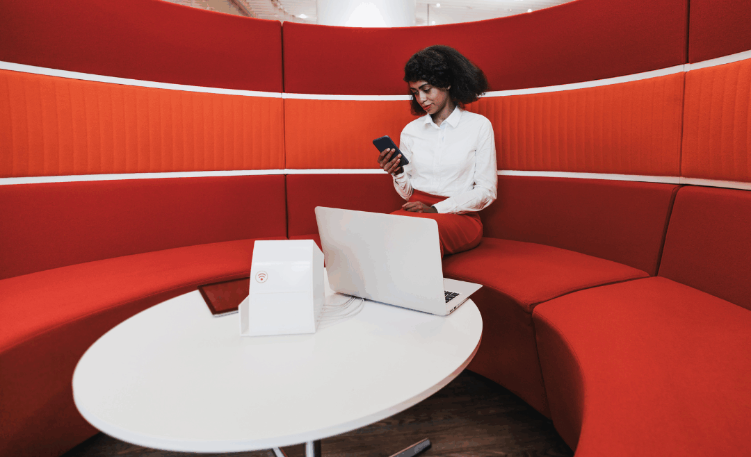 Businesswoman sitting in a red sofa