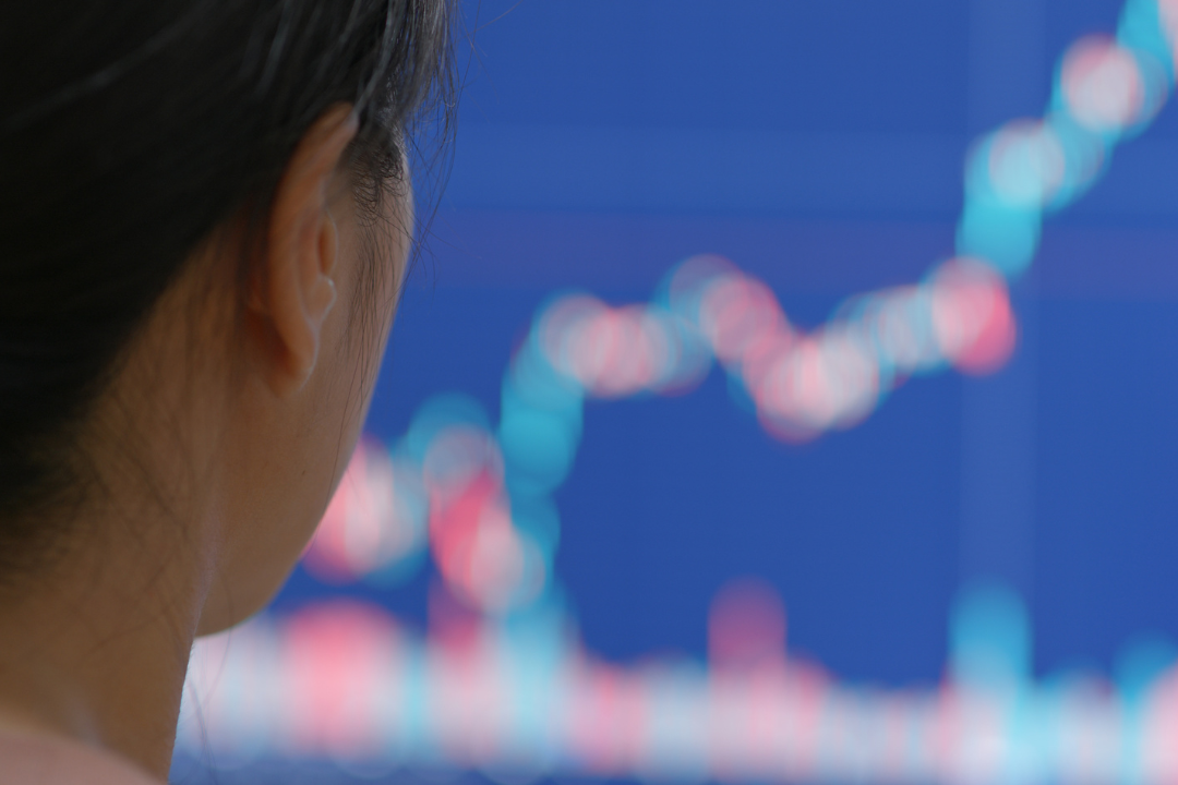 Woman watching stocks