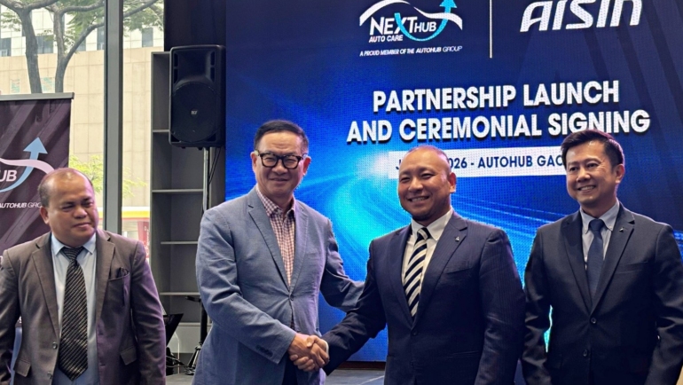 AISIN and NEXTHUB officials make the partnership official with MOA signing and a handshake